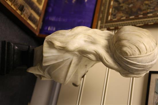 A Continental Art Nouveau carved marble bust modelled as a young woman, 21.5in.